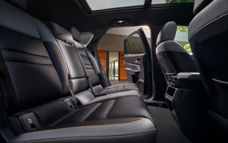 2026 Honda Prologue Elite interior, with gray leather seats viewed from the side.